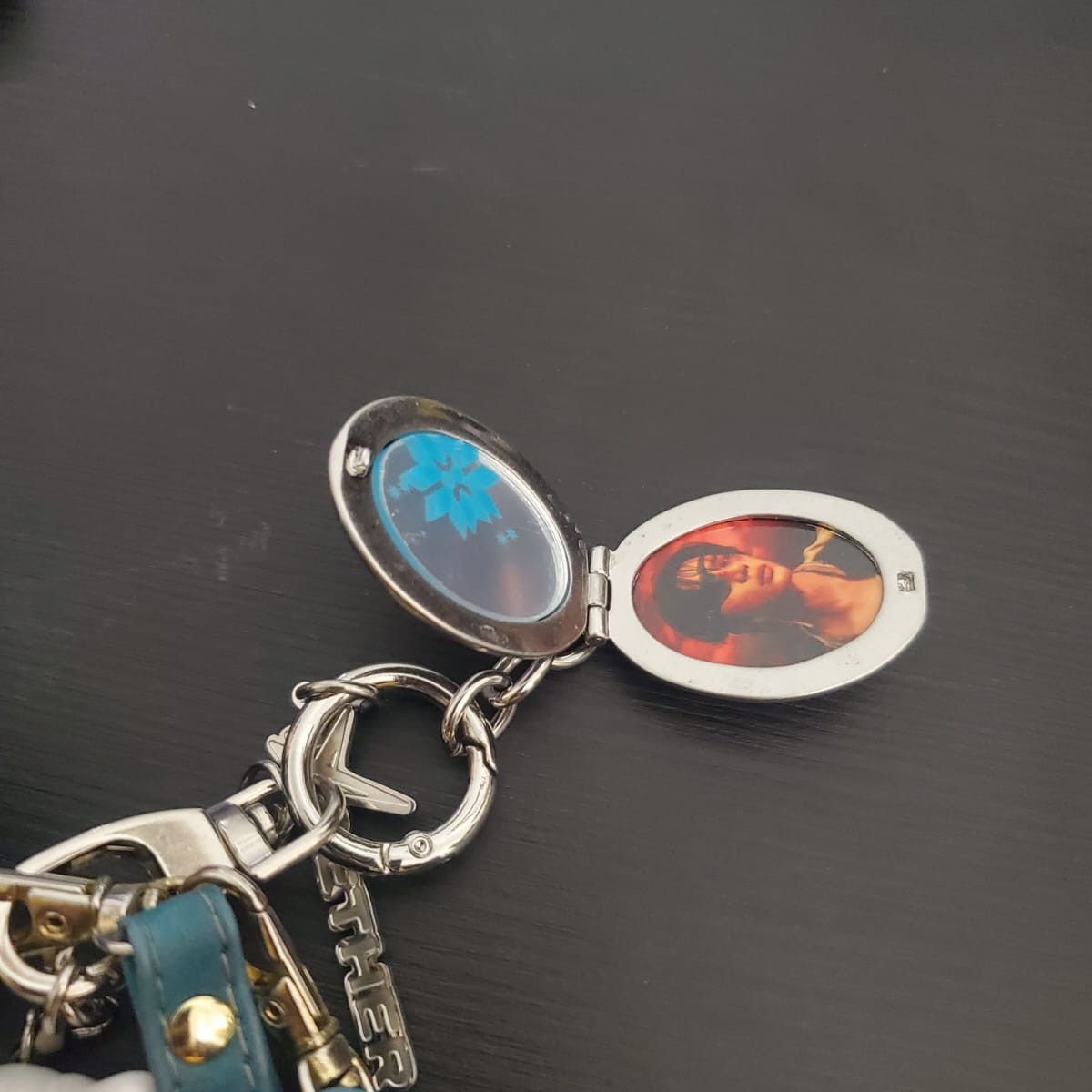 A hinged locket shown open, emphasizing the interior space revealed through movement.