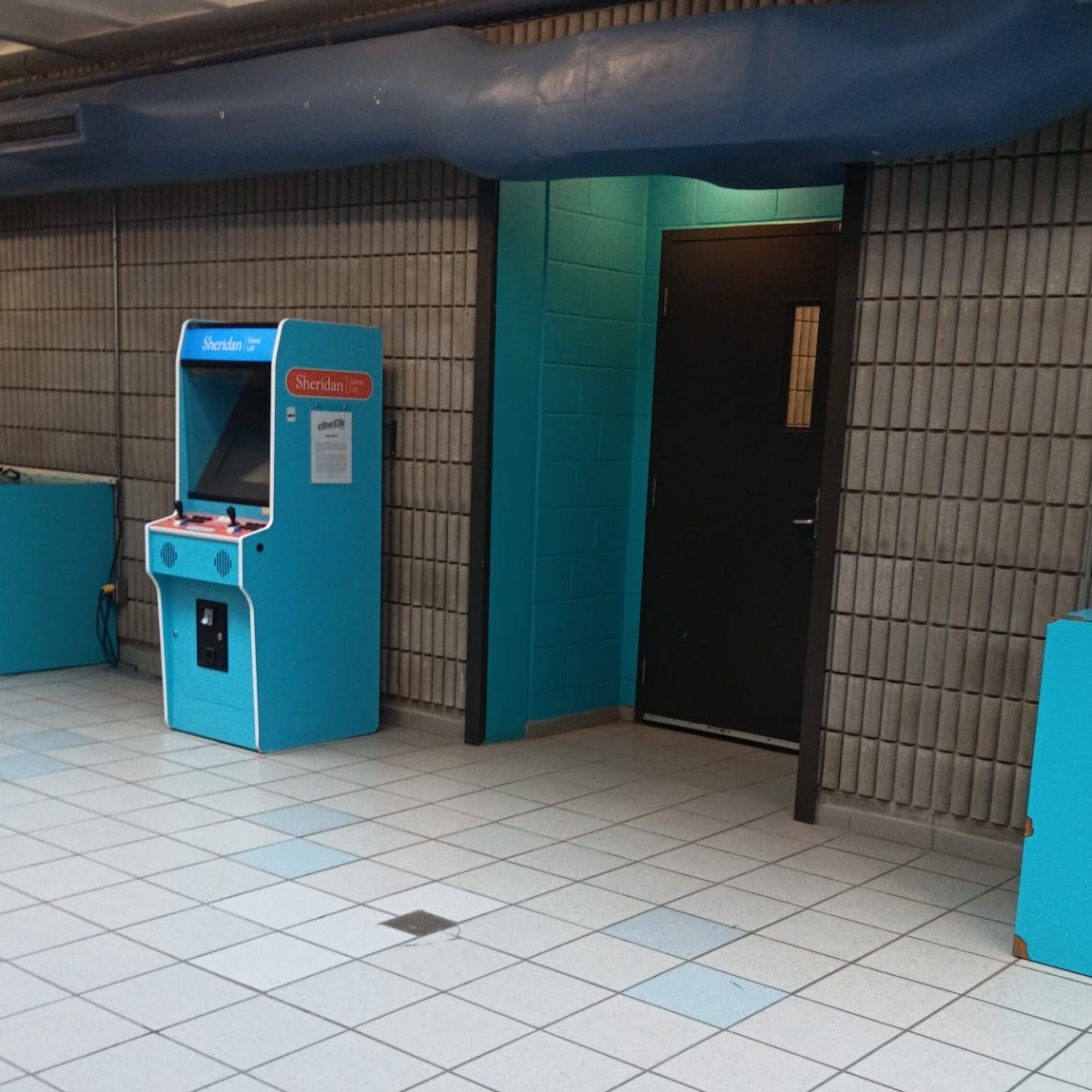 B Wing at the College:
Footsteps and conversations echoed along the hallway walls. The sound traveled and lingered slightly before fading.