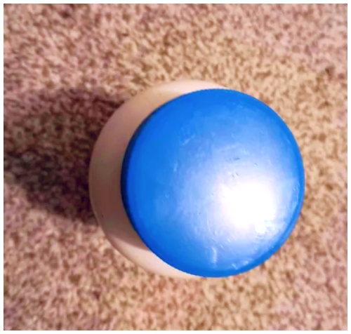 Blue cap of a medicine bottle.