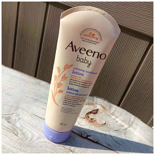 Baby skin cream with a purple cap standing upright.