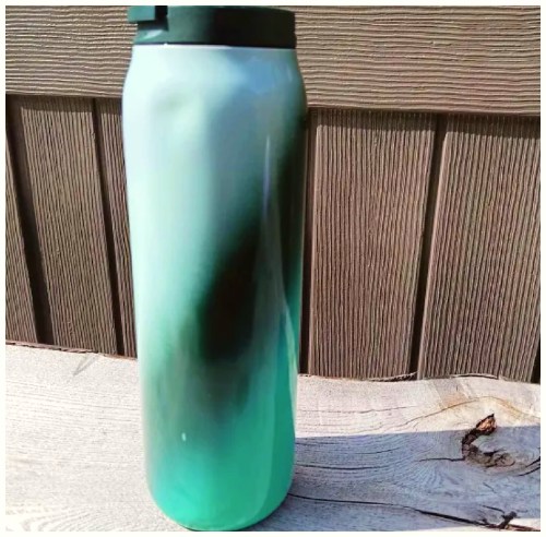 full view of my water bottle, its green and blue.