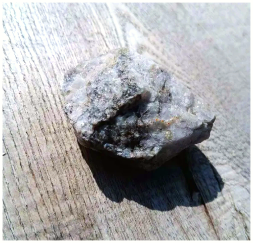 Sliver shining rock I found in my aunt's backyard.